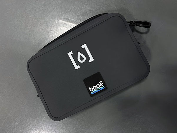pad printing example on a black bag with a white logo
